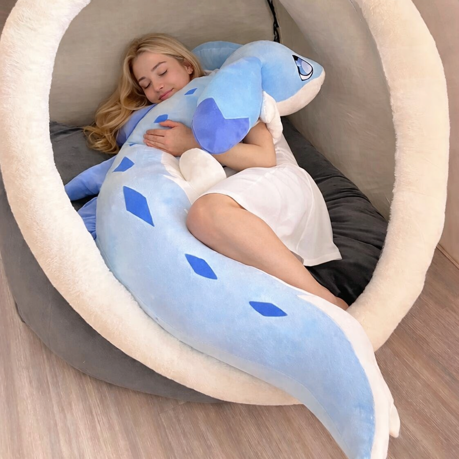 Large blue Kawaiies animal body pillow being cuddled