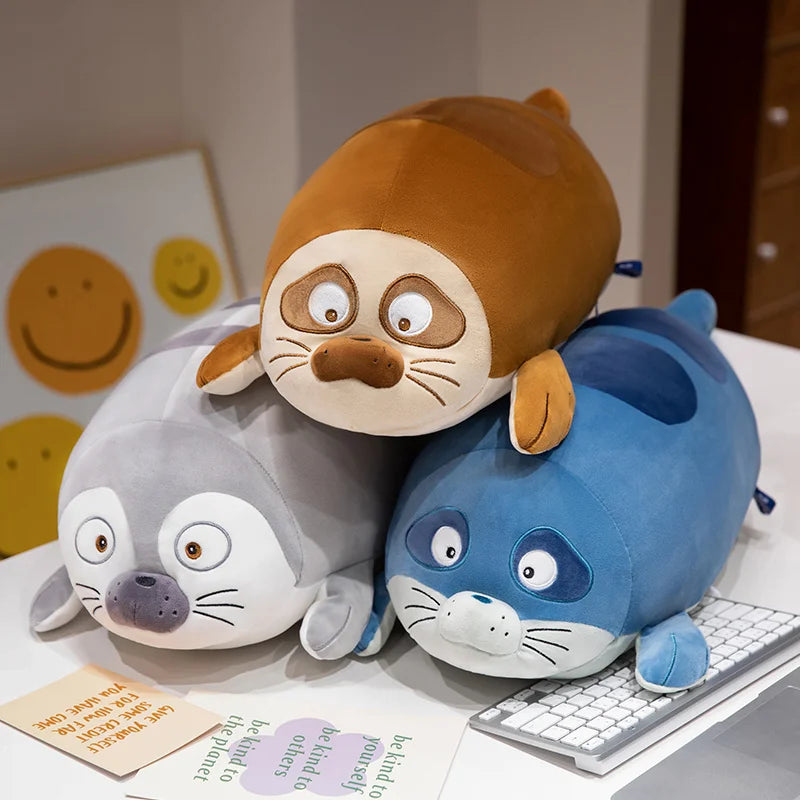 Three round sleeping seal plushies from Kawaiies