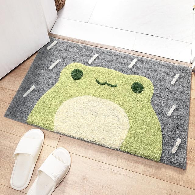 https://www.kawaiies.com/cdn/shop/products/kawaiies-plushies-plush-softtoy-kawaii-green-smiling-frog-bathroom-mat-new-home-decor-45x65cm-573643.jpg?v=1621443339
